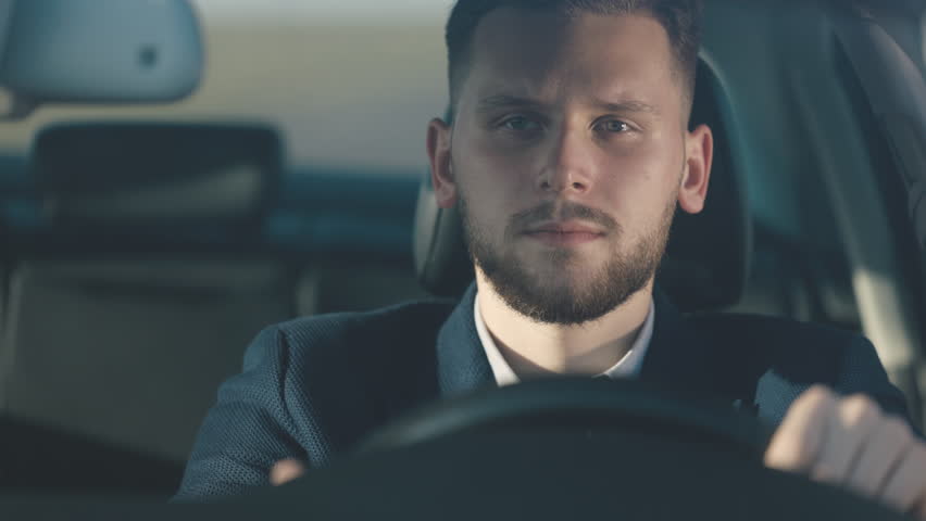 Tired man driving on highway, eyes closes drop and falls asleep behind wheel, loses focus, suddenly opens eyes and resumes car's movement Royalty-Free Stock Footage #1109623653