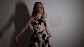 Thoughtful dancer's graceful solo performance in shadow