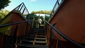 a guy performs acrobatics on the street, parkour, a man jumps over obstacles on the street - Powered by Shutterstock - Get 15% off with code: PIKWIZARD15