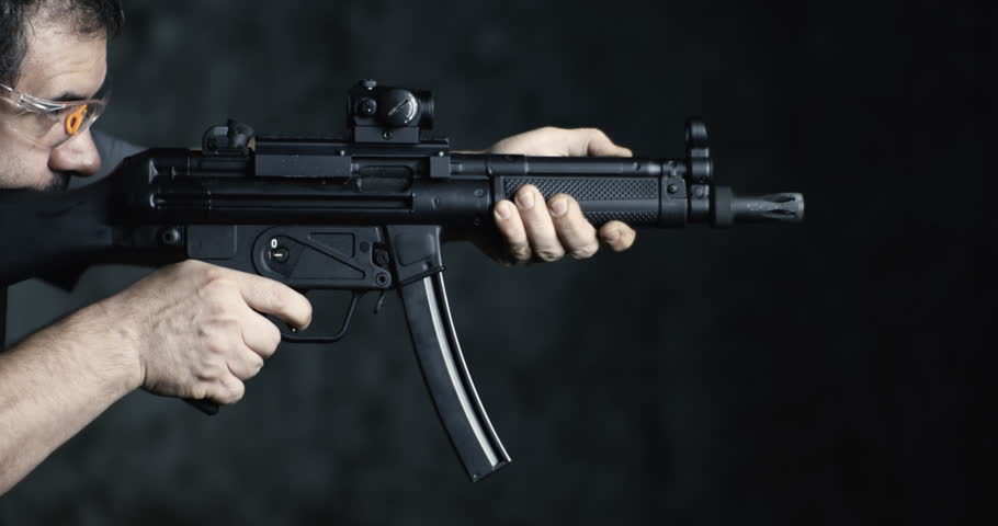 High-Speed Shooting with HK SP5K Assault Rifle, Side Perspective of Person Aiming and Firing
