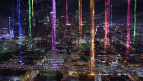 Aerial View of Downtown Los Angeles at Night. Smart Colorful Connected City with Multicolored Columns and Network Connections. Rainbow  LTGBQ Colors. Highway and avenues full of traffic. Shot in 8K - Powered by Shutterstock - Get 15% off with code: PIKWIZARD15