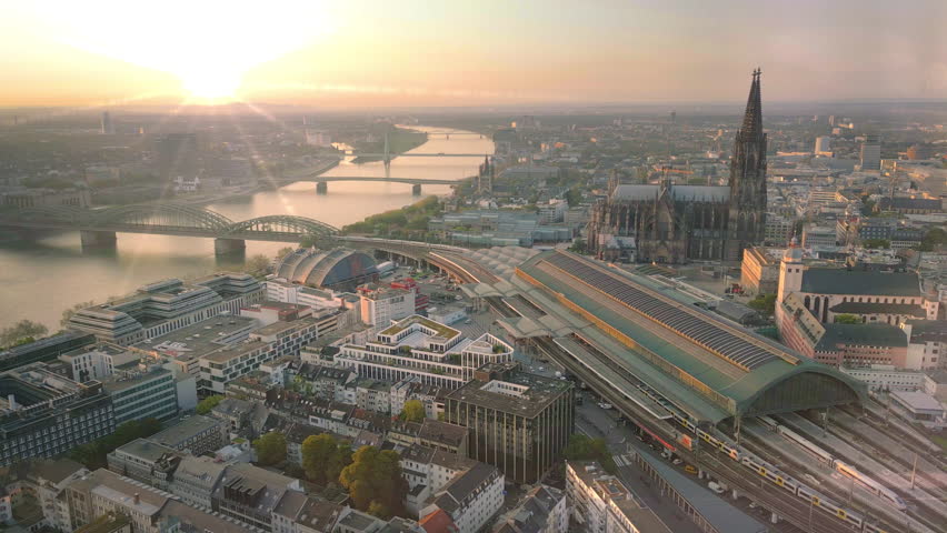 Germany Cologne city skyline aerial view drone footage of city downtown old town in front cologne cathedral (dom) top view of cologne bridge and river at sunset. Royalty-Free Stock Footage #1109643613