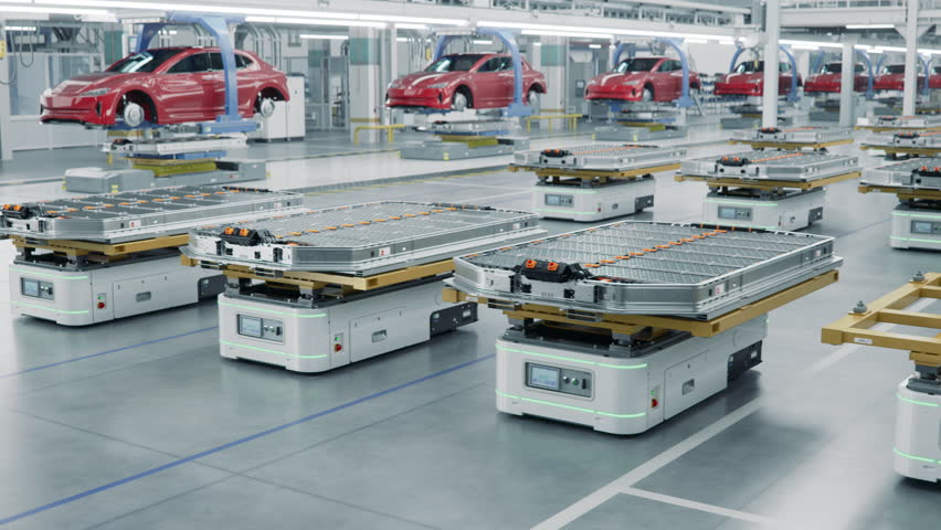 Automated Guided Vehicles with Electric Car Battery Packs inside Modern Automotive Factory. EV Production Line on Advanced Factory. High Performance Electric Car Autonomous Manufacturing Processes Royalty-Free Stock Footage #1109644905