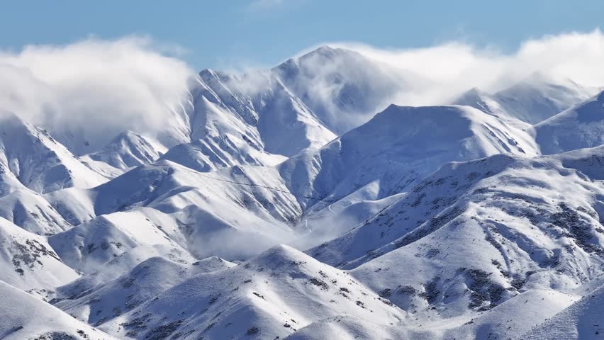 Breathtaking mountain alpine scenery, fresh winter snow on high peaks. New Zealand aerial drone