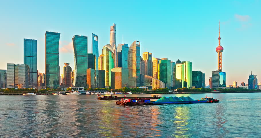 Shanghai city architecture skyline and river with boats. Removed building trademark and advertising