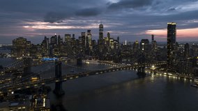 Establishing Aerial View Shot of New York City NY, NYC, United States, downtown Manhattan, Manhattan Bridge, Brooklyn Bridge, East River, New York Skyline, night evening dusk dawn, super clear image 