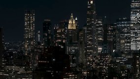 Establishing Aerial View Shot of New York at night evening City NY, NYC, super clear image, The Woolworth Building, circling right, downtown Manhattan