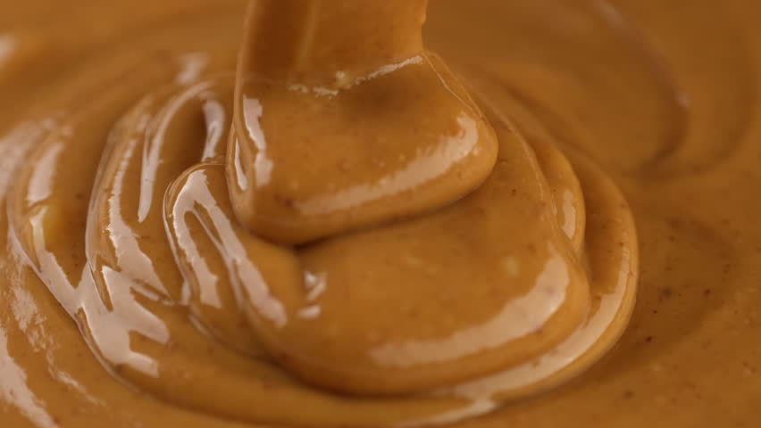 Pouring peanut butter, close up Royalty-Free Stock Footage #1109658373