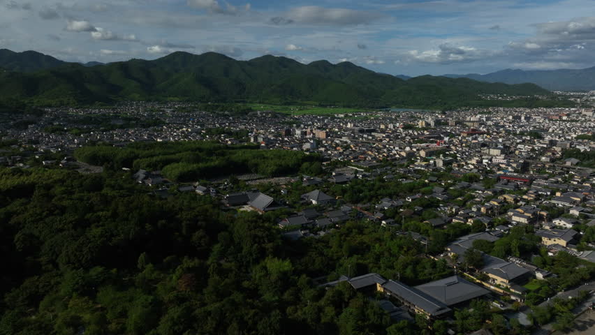 Drone shot circling the Sagatenryuji Susukinobabacho area, summer in Kyoto, Japan