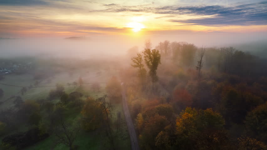 Hyperlapse time lapse footage of amazing scenic rural landscape with the fog gliding over the meadows and trees towards the rising sun
 | Shutterstock HD Video #1109663449