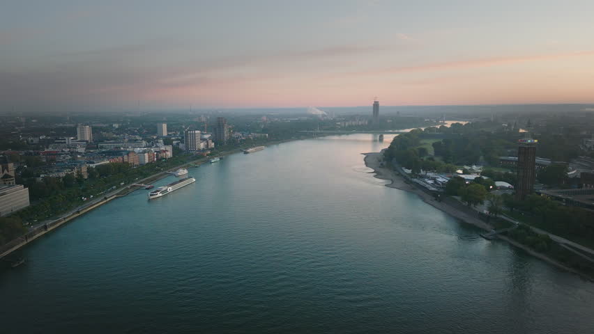 Cologne germany city skyline aerial view drone footage of cologne city in germany fly over river and bridge at sunset. Royalty-Free Stock Footage #1109667913