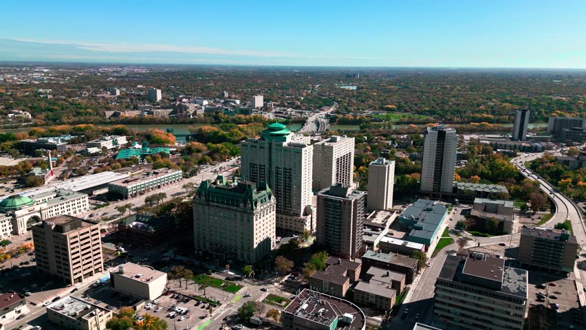 Slow Timelapse Orbit Daytime Landscape Drone Footage of The Fort Garry Hotel Historic Landmark in Downtown Urban Canadian City Spinning Restaurant Tourist Attraction Winnipeg Manitoba Canada