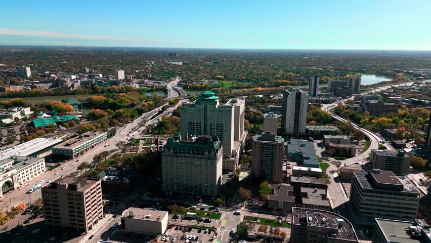 Cinematic Orbit Daytime Landscape Drone Footage of The Fort Garry Hotel Historic Landmark in Downtown Urban Canadian City Spinning Restaurant Tourist Attraction Winnipeg Manitoba Canada