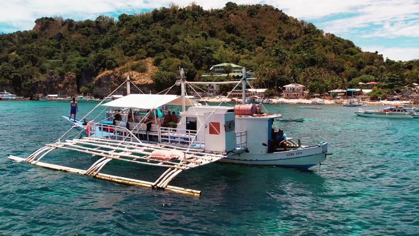 Filipino boat anchored near the island Royalty-Free Stock Footage #1109670343