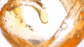Close-up an appetizing wave of apple juice swirls inside the glass. High quality FullHD footage - Powered by Shutterstock - Get 15% off with code: PIKWIZARD15