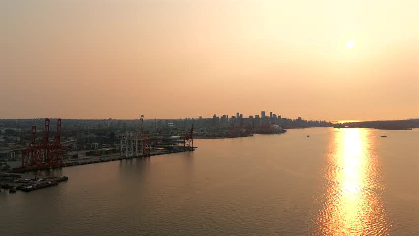 Aerial view of Port of Vancouver, harbour and mountains on the background
