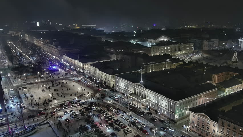 Helsinki.Finland-December 31.2021: Drone shot showing fireworks in the centre of Helsinki. New years eve. Wintertime. Pretty cityscape. Nighttime. Camera slowly moving backwards.