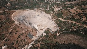 Quarry in Greece seen from aerial perspective. Rocks or minerals being extracted from the surface of Earth. . High quality 4k footage