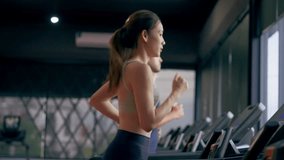 Fit young woman and man running on a treadmill during a workout class at fitness gym - Powered by Shutterstock - Get 15% off with code: PIKWIZARD15