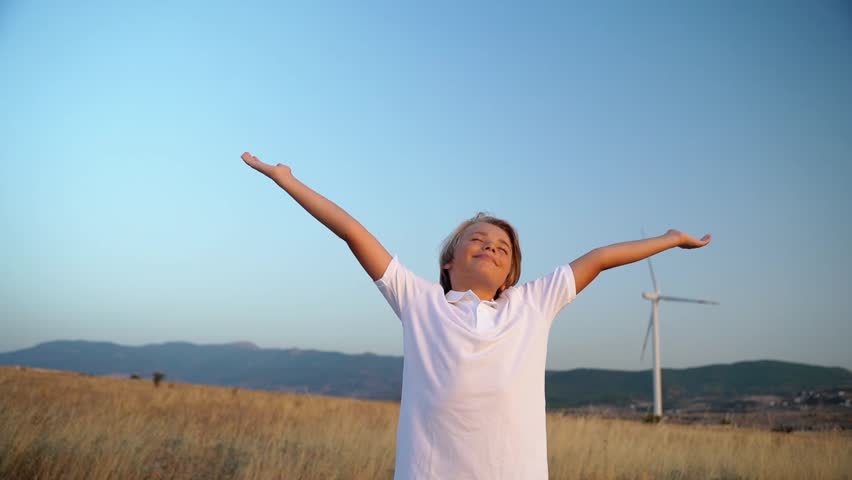Relaxed teen boy breathing fresh air raising arms over blue sky sunset twilight at summer. Dreaming, freedom and traveling concept. Royalty-Free Stock Footage #1109693615