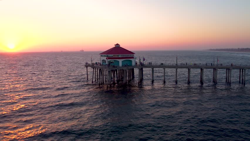 Beautiful HB Pier At Sunset Golden Hour with golden Skies and Golden Water. Drone Shot. Huntington Beach Pier, Orange County California. 1 of 10