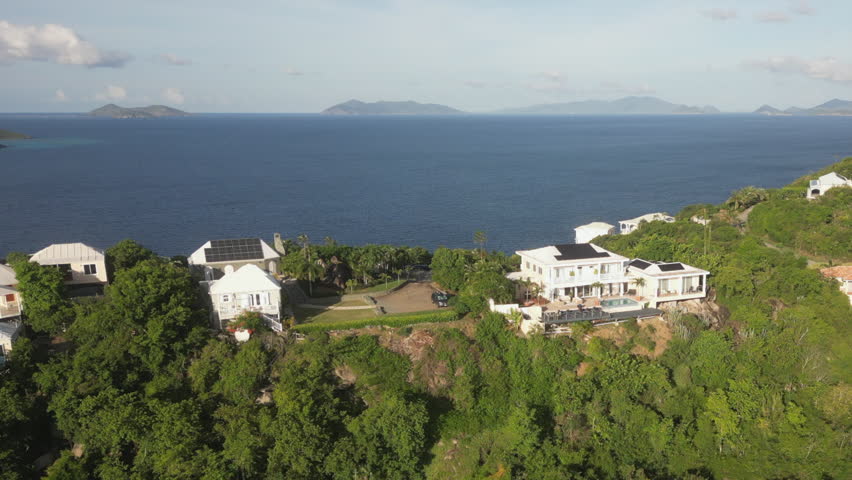 Aerial: Affluent estate mansions on summit ridge of St Thomas USVI