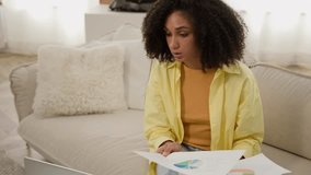 African American woman businesswoman interior designer working with financial graphs market research color palette guide for home design graphic project talk with client laptop video call conference - Powered by Shutterstock - Get 15% off with code: PIKWIZARD15