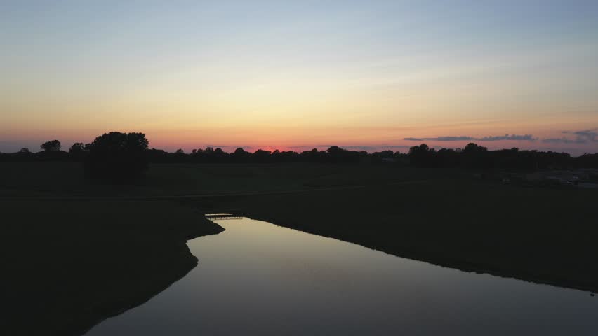 This is a beautiful sunset shot of the Missouri countryside. This is a level push into the sunset.
