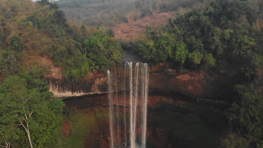 Wide shot of Tad Jarou Halang waterfall at laos Bolaven Plateau, aerial Royalty-Free Stock Footage #1109712719