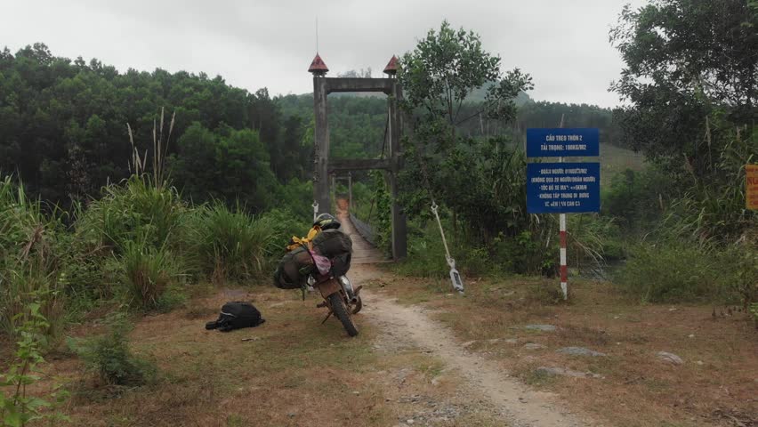 Old wooden bridge at rural Vietnam during day time, aerial