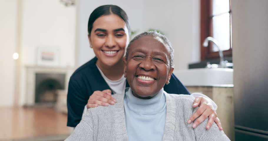 Face, doctor and patient with smile in nursing home for rehabilitation, care or wellness in health. Diversity, caregiver and elderly person for happiness, excitement or joy in expression of recovery Royalty-Free Stock Footage #1109713197