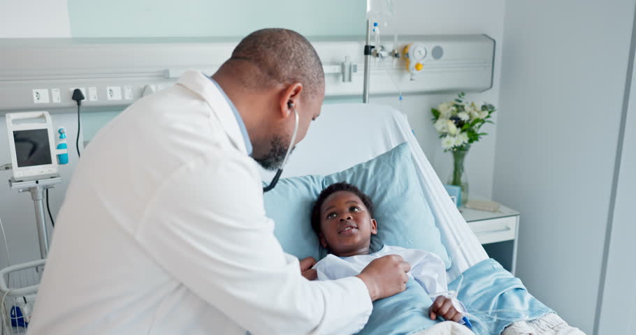 Man, doctor and checking child heart rate or beat in healthcare for wellness on bed at hospital. Male person, nurse or medical surgeon with stethoscope on little boy for health diagnosis at clinic
