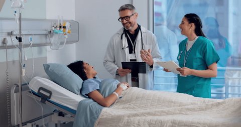 Happy man, doctor and writing with patient in diagnosis, prescription or healthcare checkup on hospital bed. Male person, medical team or surgeon talking to customer for health advice at clinic Video stock