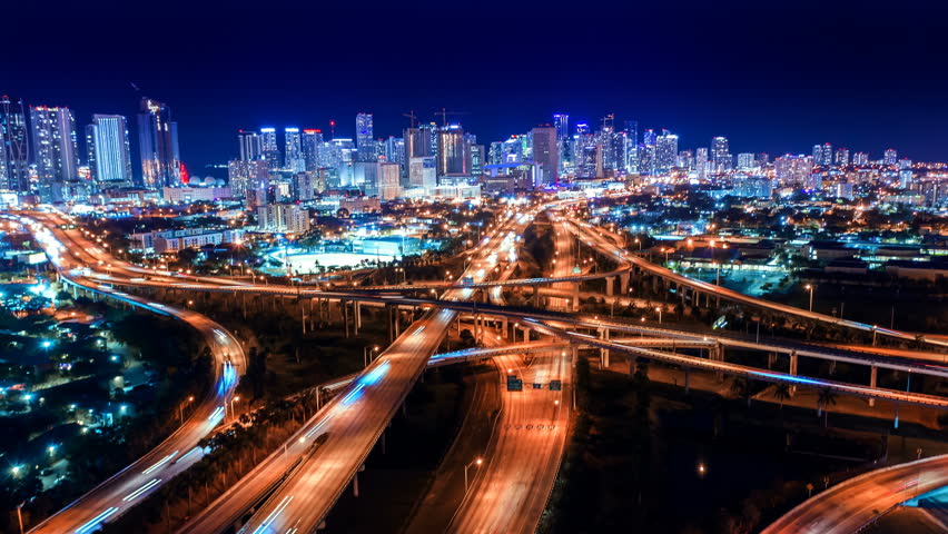 Downtown timelapse hyperlapse. Beautiful aerial shot of Night City Center. Drone flying over a city night lights. Aerial shot and top view of downtown skyline. City Traffic freeway, Traffic highway  | Shutterstock HD Video #1109714471
