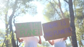 Sunny day in the forest, children with signs protesting climate change. Advocating for a sustainable, pollution-free future. Eco-conscious childhood, nature respect, environmental awareness in kids

 - Powered by Shutterstock - Get 15% off with code: PIKWIZARD15