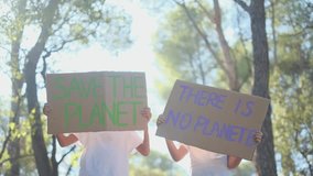 Sunny day in the forest, children with signs protesting climate change. Advocating for a sustainable, pollution-free future. Eco-conscious childhood, nature respect, environmental awareness in kids

 - Powered by Shutterstock - Get 15% off with code: PIKWIZARD15