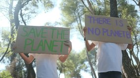 Sunny day in the forest, children with signs protesting climate change. Advocating for a sustainable, pollution-free future. Eco-conscious childhood, nature respect, environmental awareness in kids

 - Powered by Shutterstock - Get 15% off with code: PIKWIZARD15
