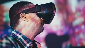 Man experiencing new VR game in a headset, augmented reality, game designer - Powered by Shutterstock - Get 15% off with code: PIKWIZARD15