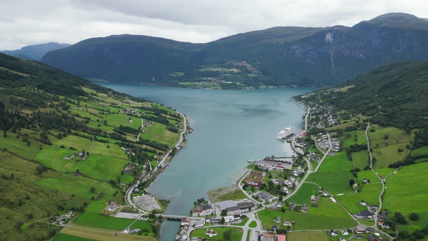 Olden Village and Cruise Ship in Nordfjord, Vestland, Norway, Scandinavia - Aerial Circling