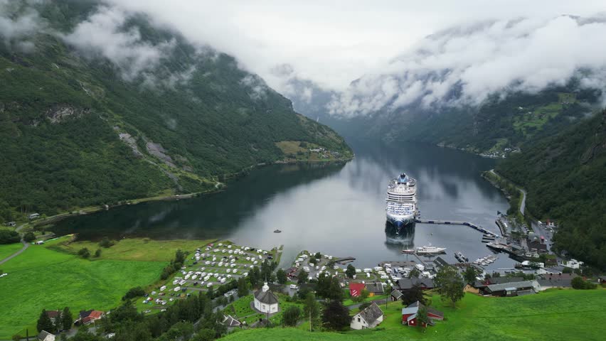 Cruise Ship in Geiranger, Norway - Scenic Geirangerfjord and Small Village in Stranda, More og Romsdal - Aerial Circling Royalty-Free Stock Footage #1109720527