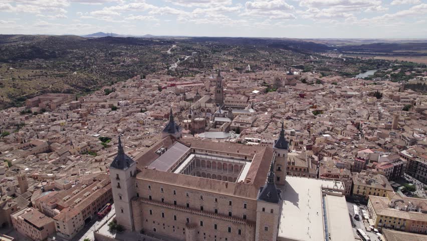 Epic aerial flying around Alcazar de Toledo fortification in Toledo, Spain
