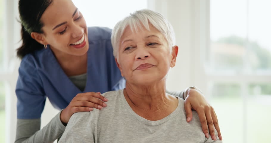 Senior care, nurse and hug with smile for support, wellness and healthcare in nursing home or retirement. Elderly, woman and caregiver or expert with embrace for medical service, happiness and job Royalty-Free Stock Footage #1109728967