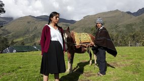 Beautiful peasant woman walking in warm sunlight next to a horse riding attractive guy .Healthy lifestyle travel concept
