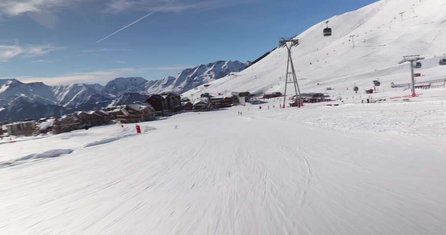 Skiing slope in the French Alpes, view from a skilift station, many people on the popular ski resort Royalty-Free Stock Footage #1109730167