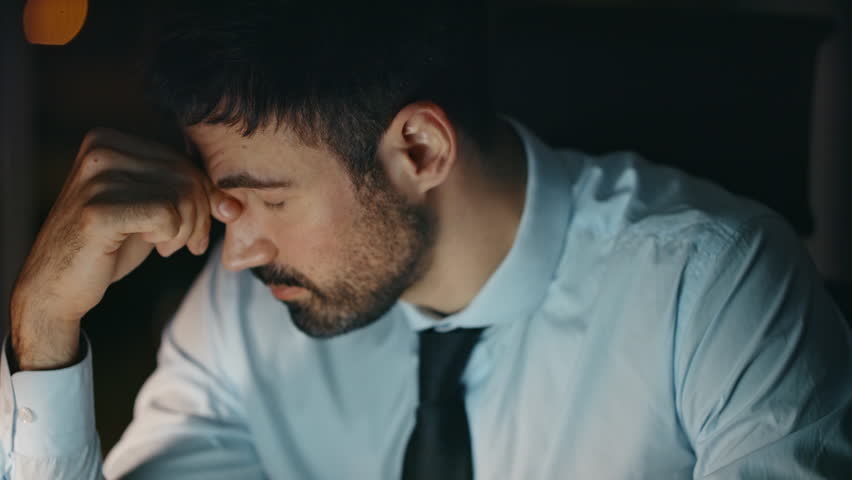 Overloaded ceo suffering headache sitting office late evening close up. Portrait of depressed bearded businessman feeling despair by business loss. Stressed overworked man manager experiencing burnout Royalty-Free Stock Footage #1109730867