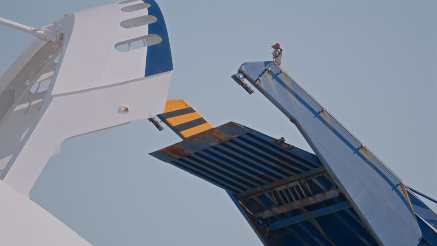 The ferry ramp gracefully closes, securing the vessel for its upcoming journey