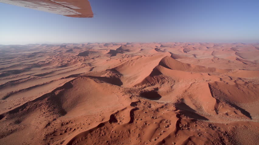 Aerial view of the Namib desert with fog at sunrise in Namibia, Africa. Royalty-Free Stock Footage #1109737953