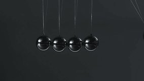 executive toy close up to Black pendulum balls - Powered by Shutterstock - Get 15% off with code: PIKWIZARD15