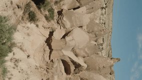 Vertical video. A panorama of the hill formations resembling towers in the Valley of Imaginations in Turkey.