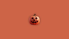 Stop motion Helloween Pumpkin appear and disappear on orange background. High quality video 4K. Detailed stop motion video. Background or wallpaper in food and drinks videos.